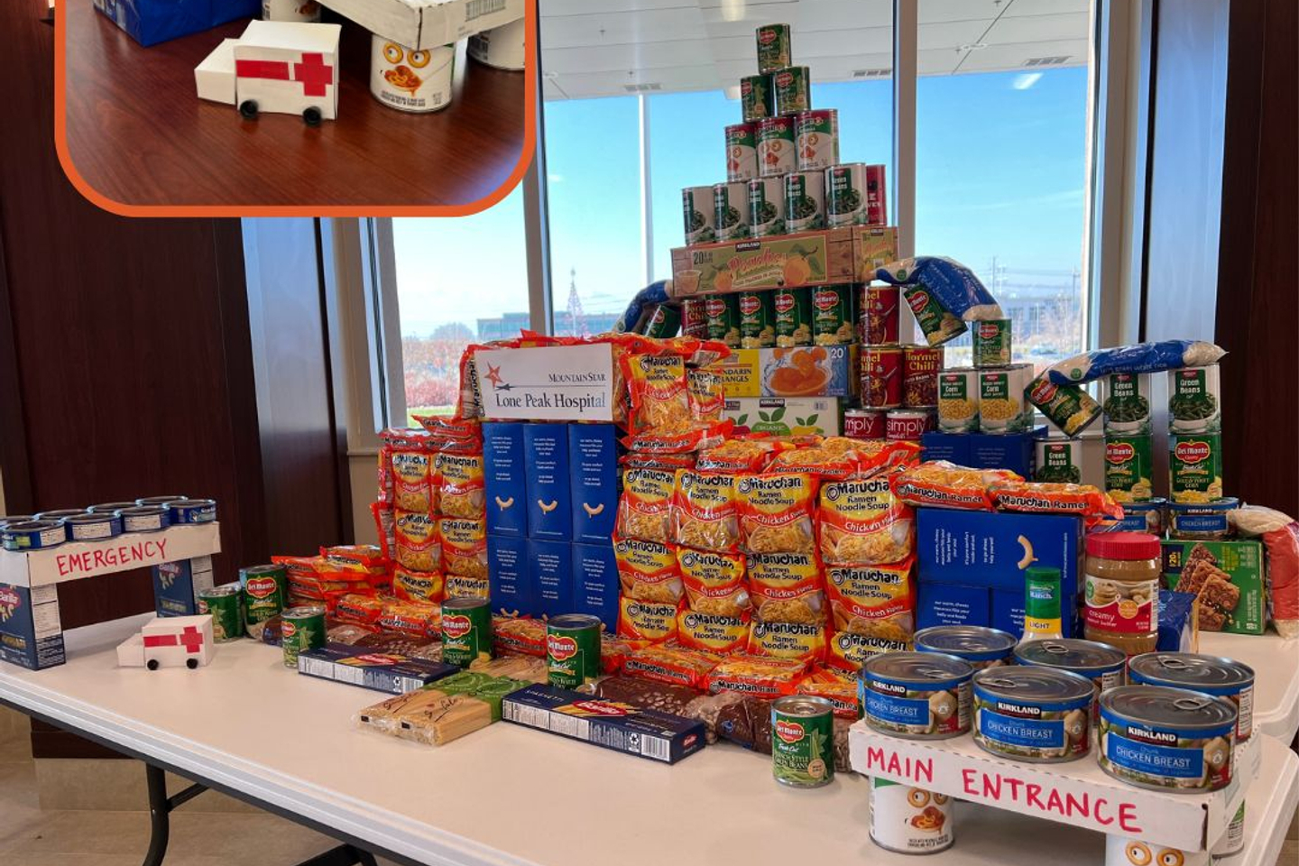 A sculpture of Lone Peak Hospital and the Herriman Emergency Center built out of non-perishable food items