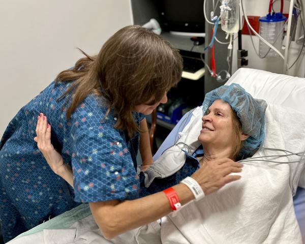 Carol Kenny and Janet Hill embrace before transplant surgery