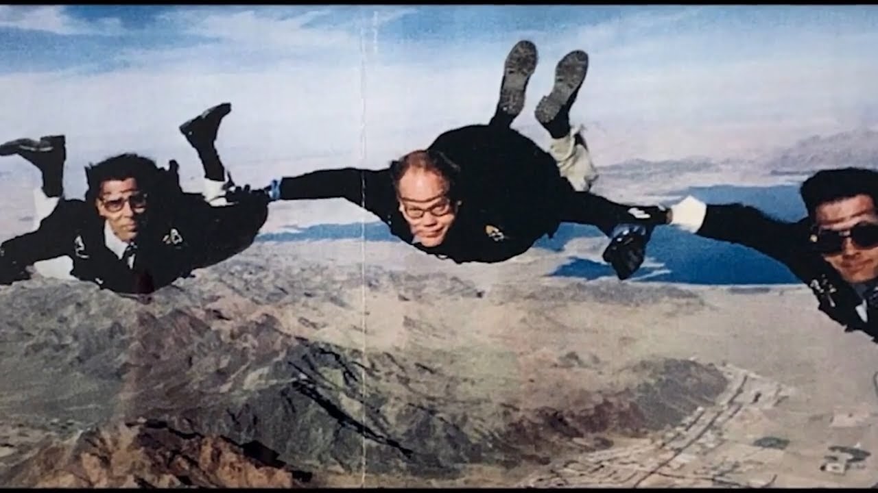 Mark Gillepsie skydiving with 2 friends