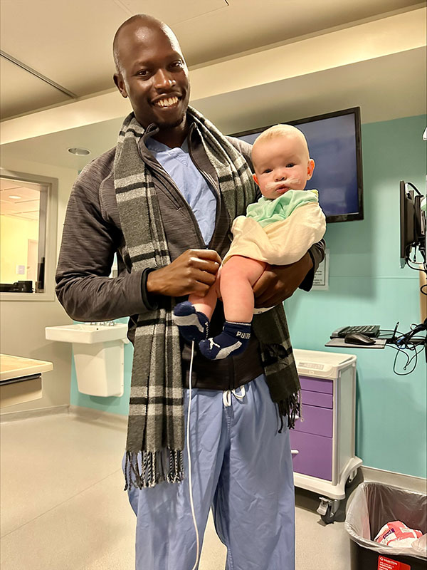 Dr. Patrick Christopher smiles while holding Parker during his time at Overland Park Regional Medical Center.