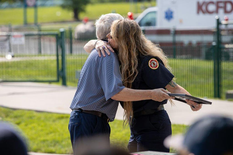Steve Remund hugs one of the EMS professionals who responded to his 911 call.