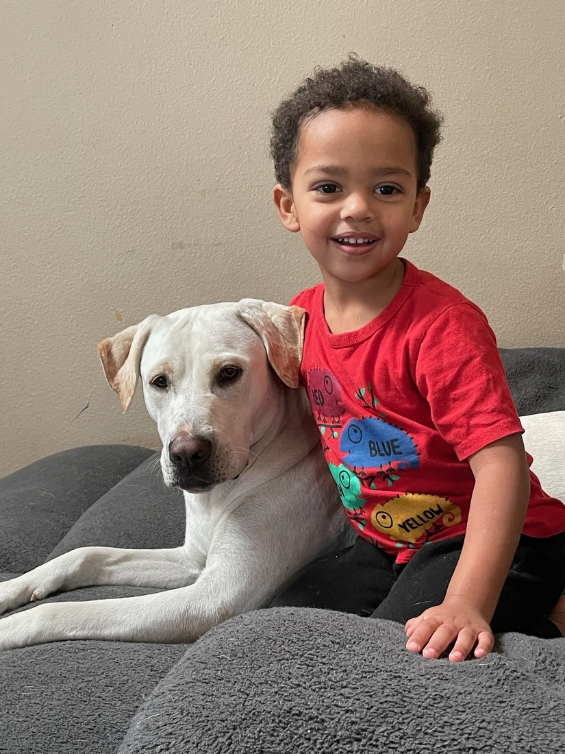 Photo of Bryson Silver at 4 years old with his dog.