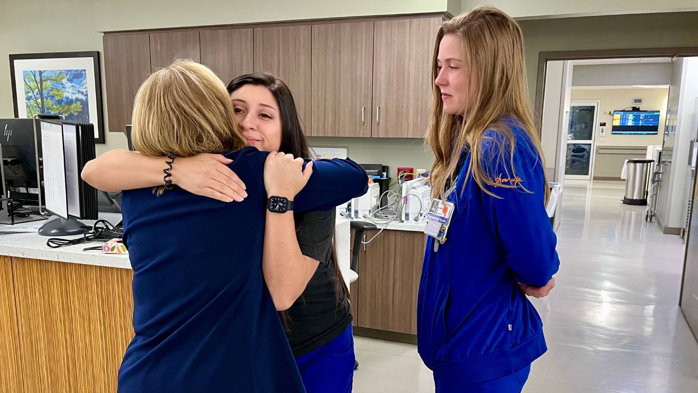 Stacy Tuckwell reunited with her nurses Alyssa Torrez (hugging) and Claire Blanken after she was discharged.