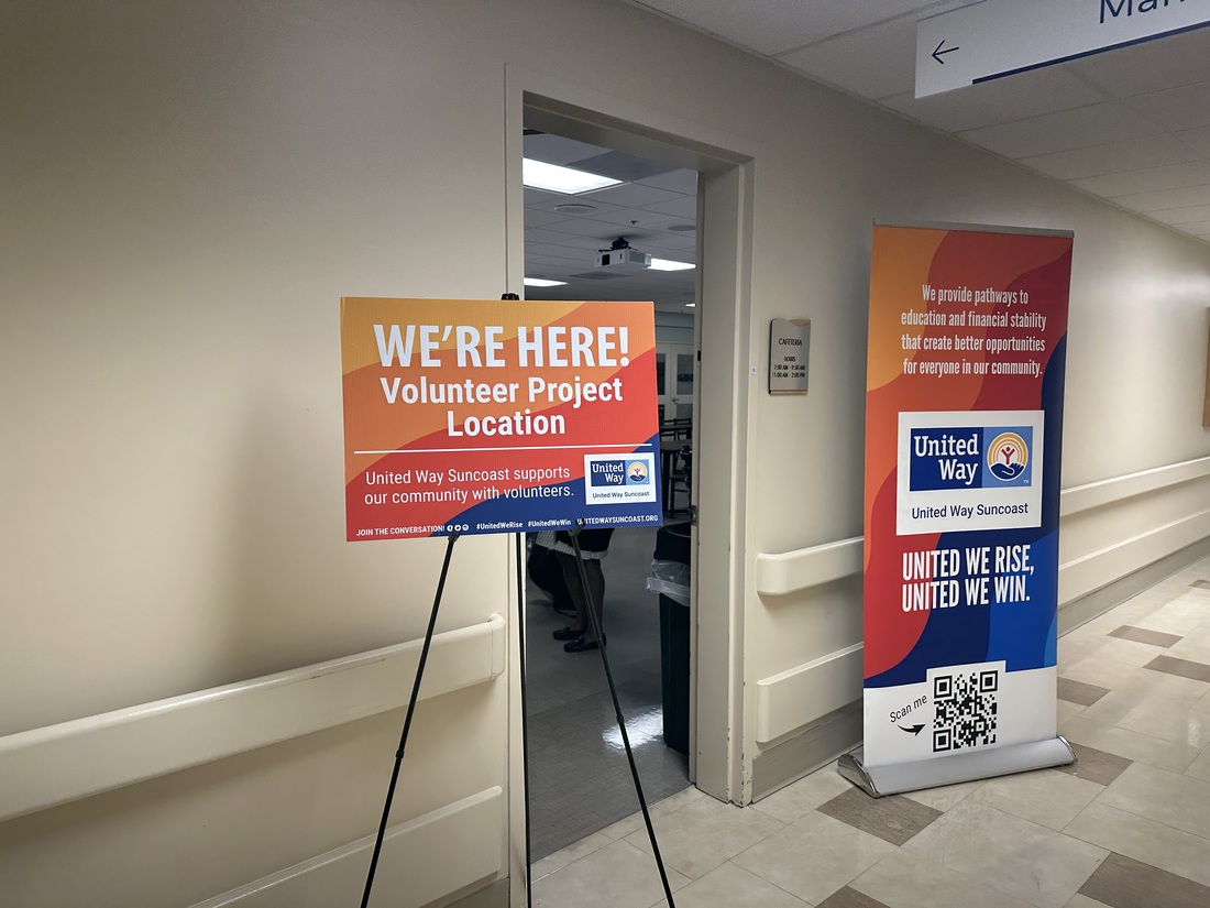 Sign and banner denoting the room for the volunteer event