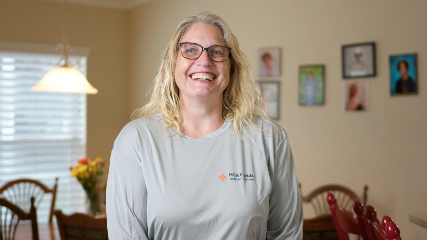Kimberly Cansler, stroke survivor, smiles in her home