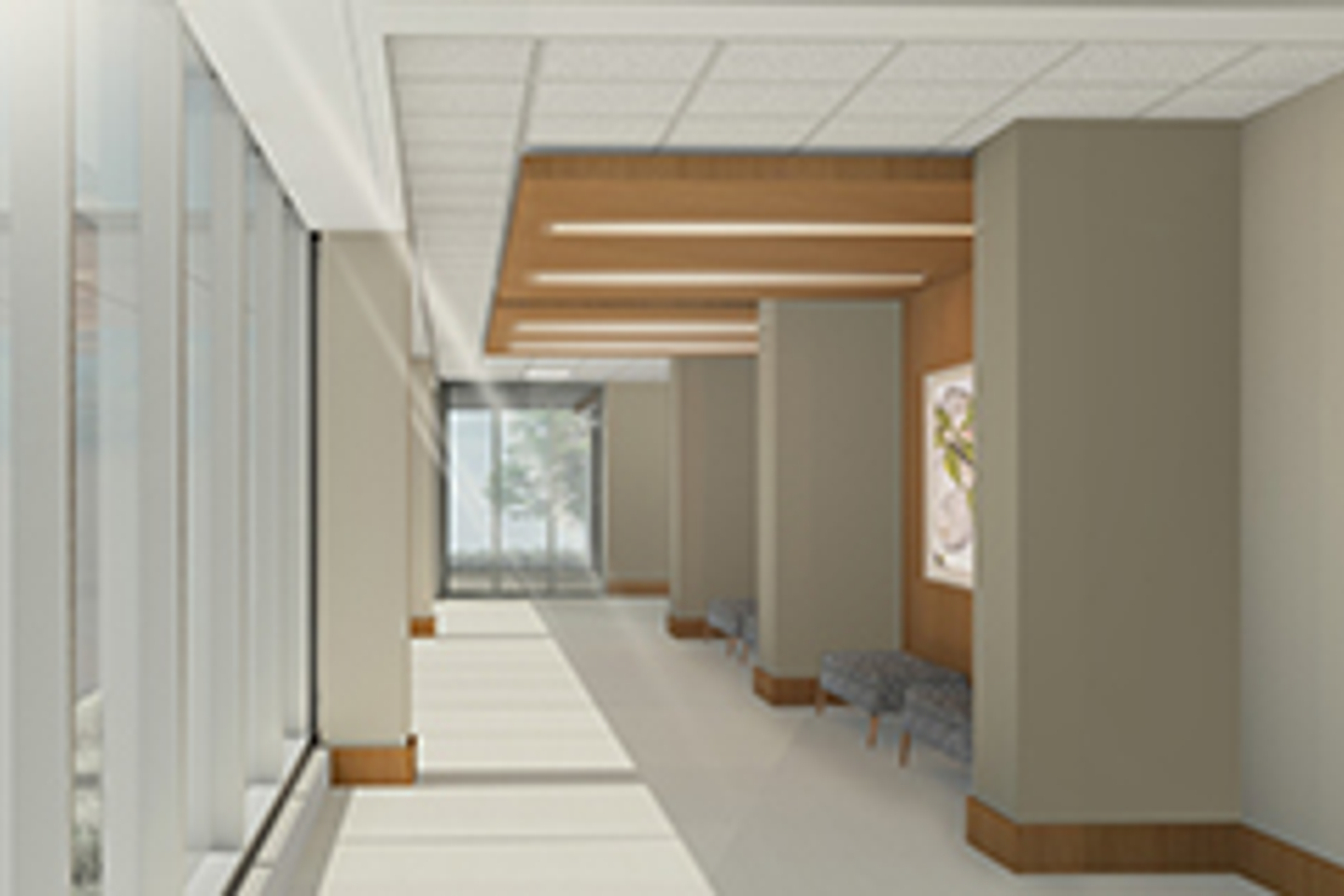 Interior view of a hallway in Reston Hospital Center, windows to the left and bench seating to the right along the wall.