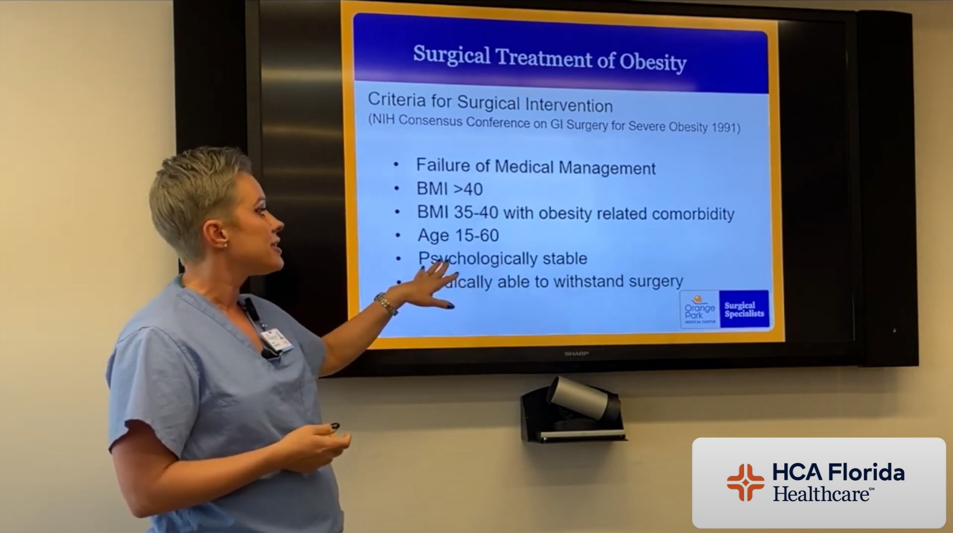 Physician presents information on a screen about weight-loss surgery at HCA Florida Orange Park Hospital.