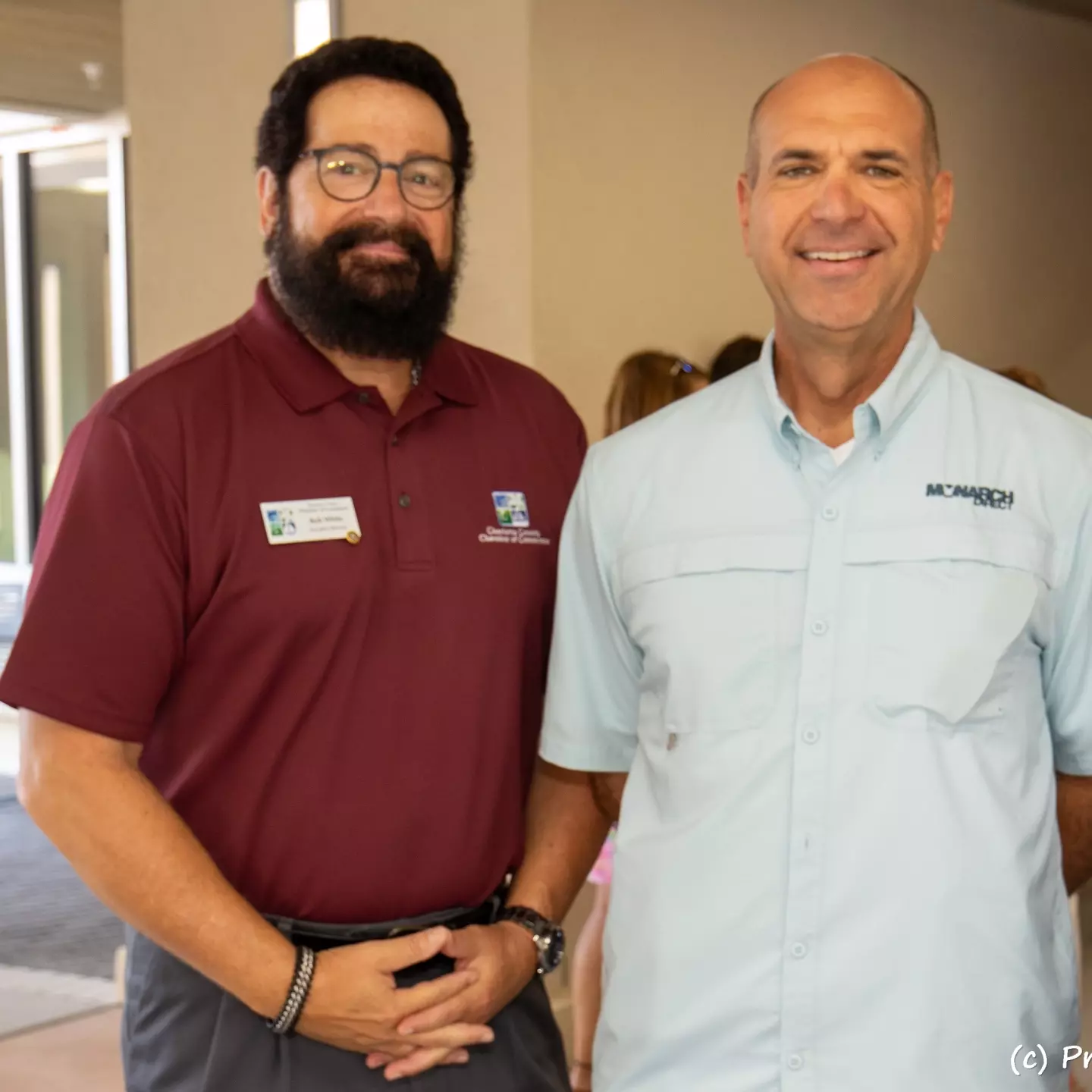 Three gentlemen attending the ribbon cutting ceremony