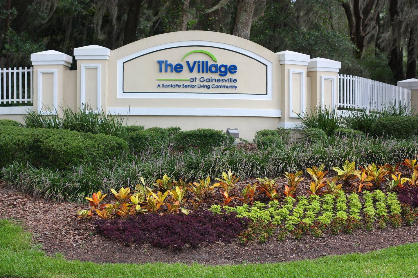 Entrance sign for the The Village at Gainesville - A SantaFe Senior Living Community