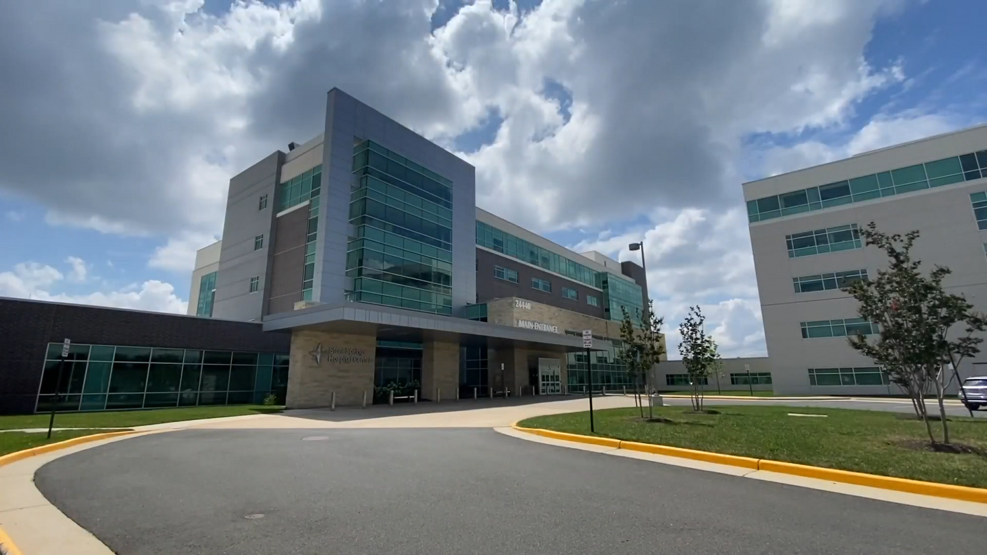 The exterior view of the StoneSprings Hospital Center on a partial sunny day