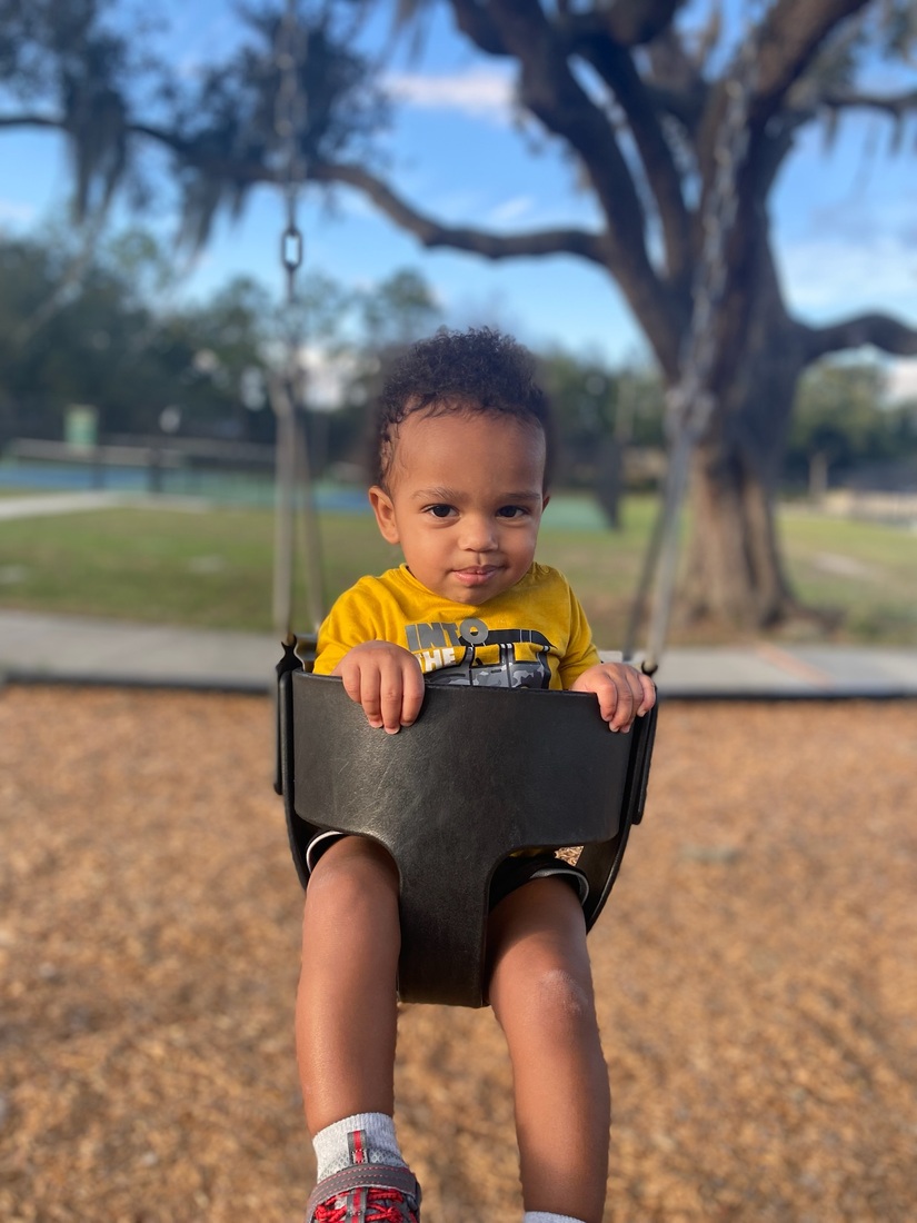 Bryson Silver photo, toddler in swing