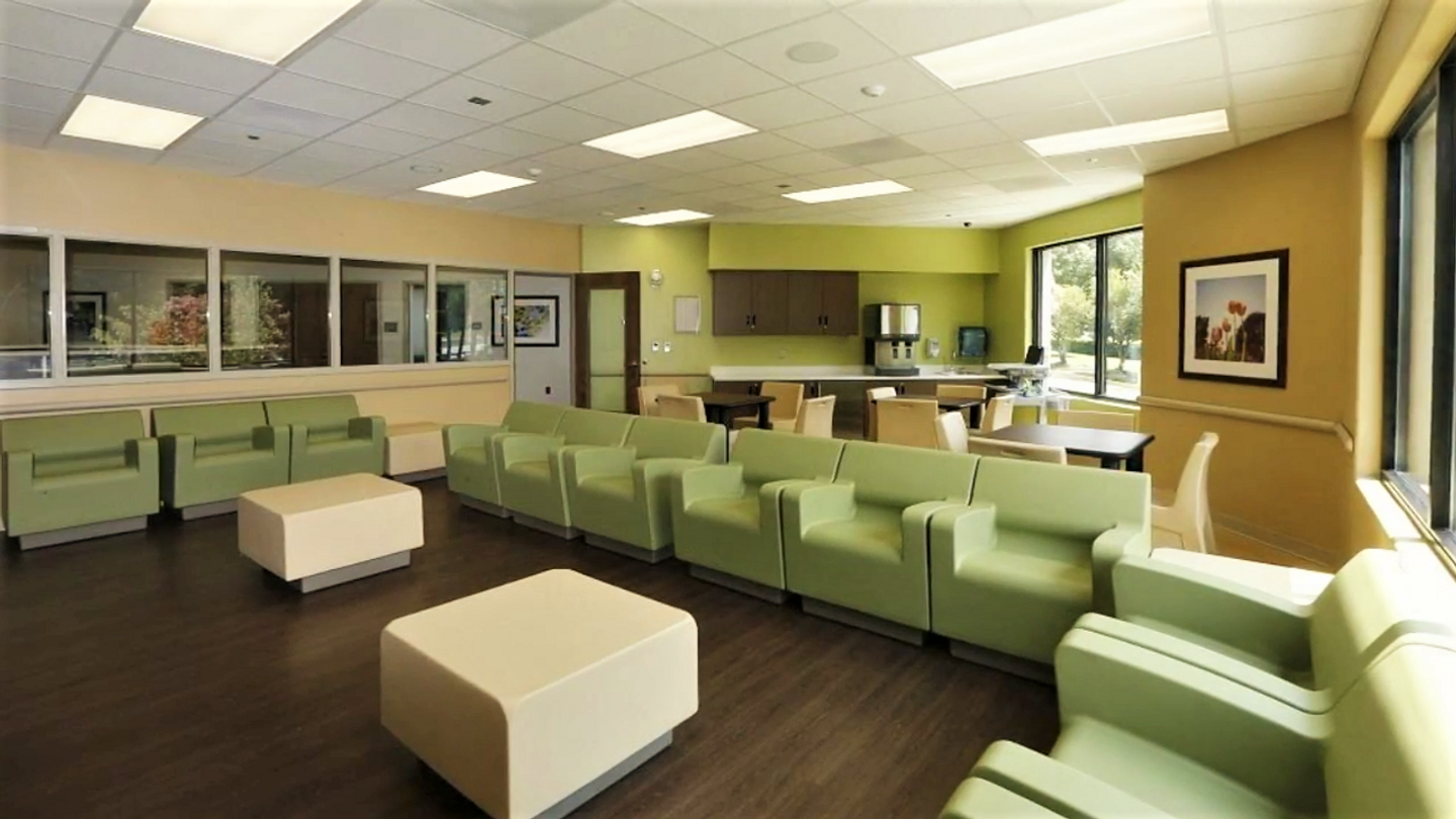 The Day Room at Tucker Pavillion, filled with comfortable seating for activities and socializing.