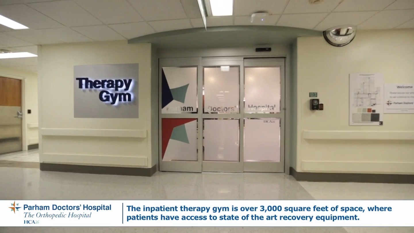 Looking at the Therapy Gym in the Rehabilitation Unit at the Henrico Doctors' Hospital Parham campus. Text on screen: Parham Doctors' Hospital The Orthopedic Hospital HCAVA. The inpatient therapy gym is over 3,000 square feet of space, where patients have access to state of the art recovery equipment. 