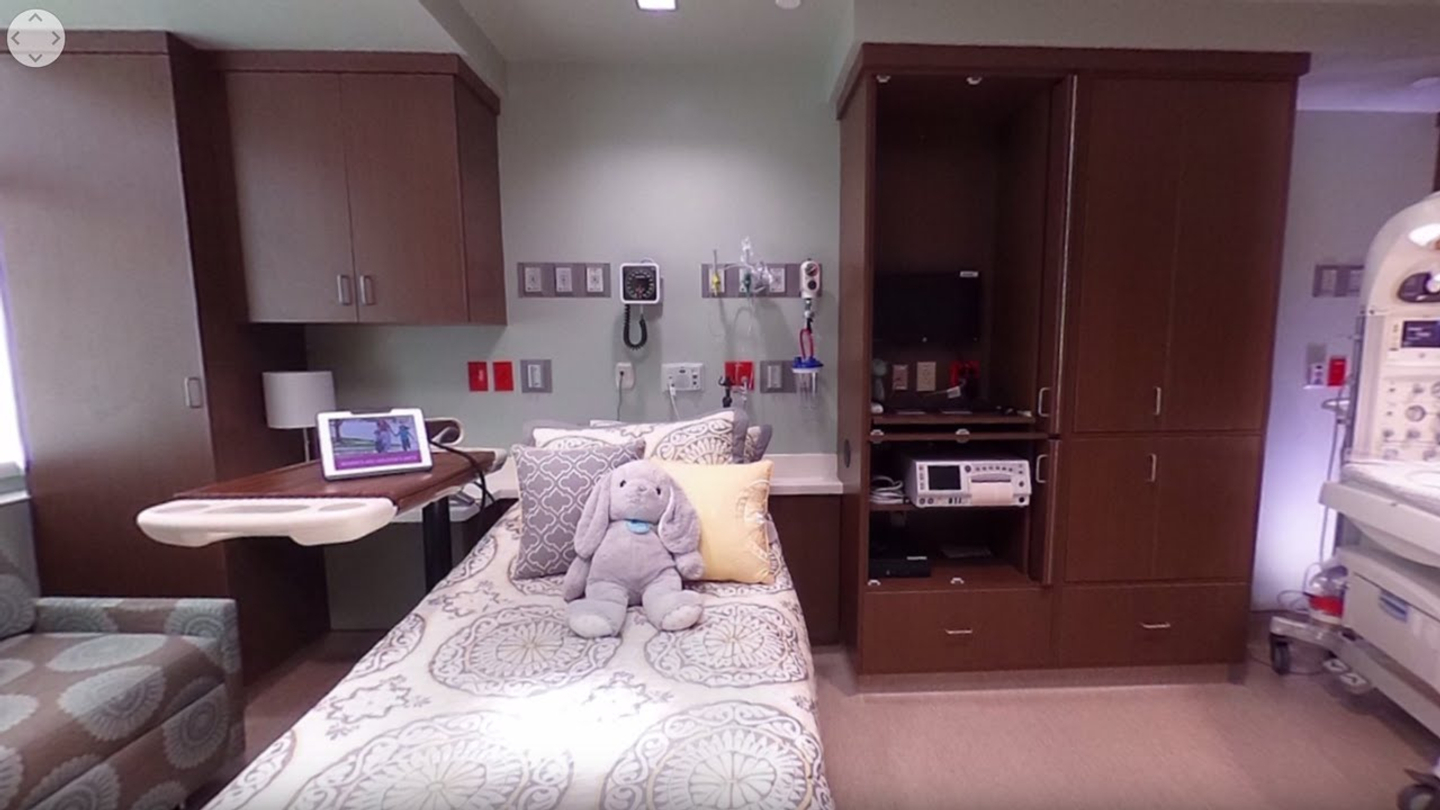 A Labor and Delivery Unit hospital room with a stuffed elephant toy place on the bed.