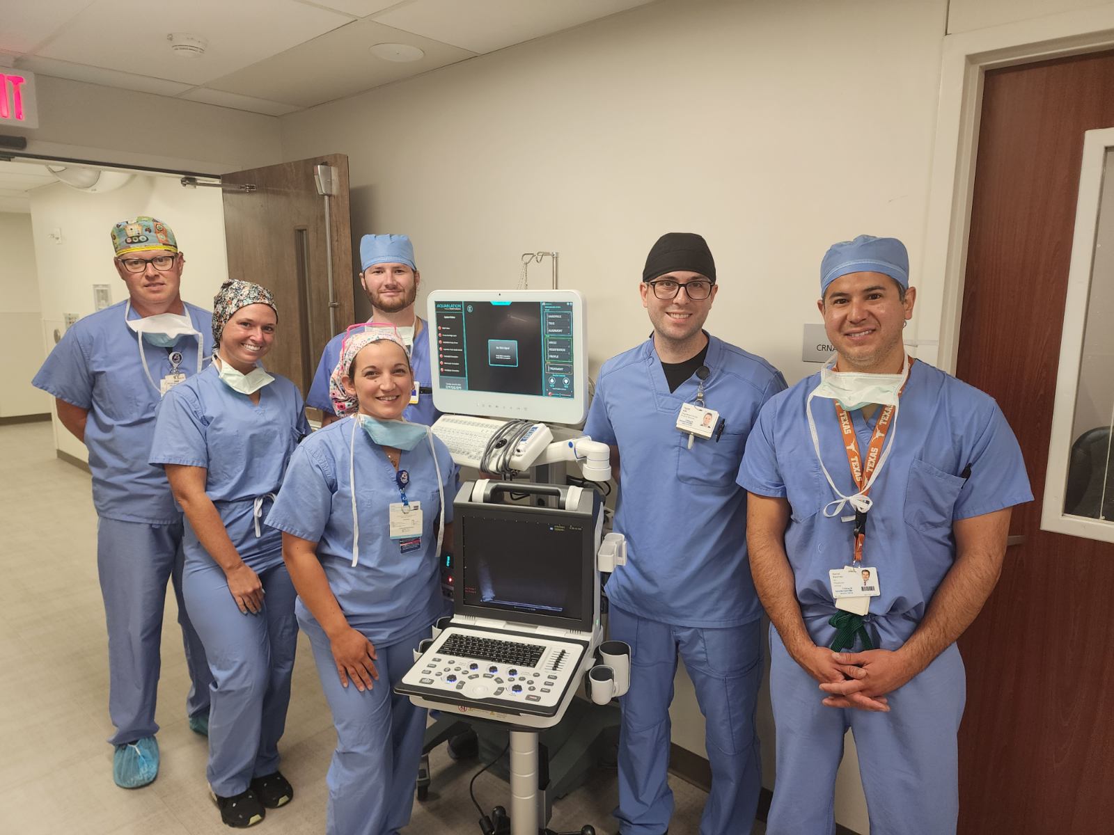 Pictured is Daniel Ramirez, MD, urologist at TriStar Hendersonville, the AquaBeamâ Robotic System and the surgical team who completed the first procedure:  Jason Powell, Sydney Cook, Hyatt Harrom, Chassity Bruce, and Caleb Krutak.