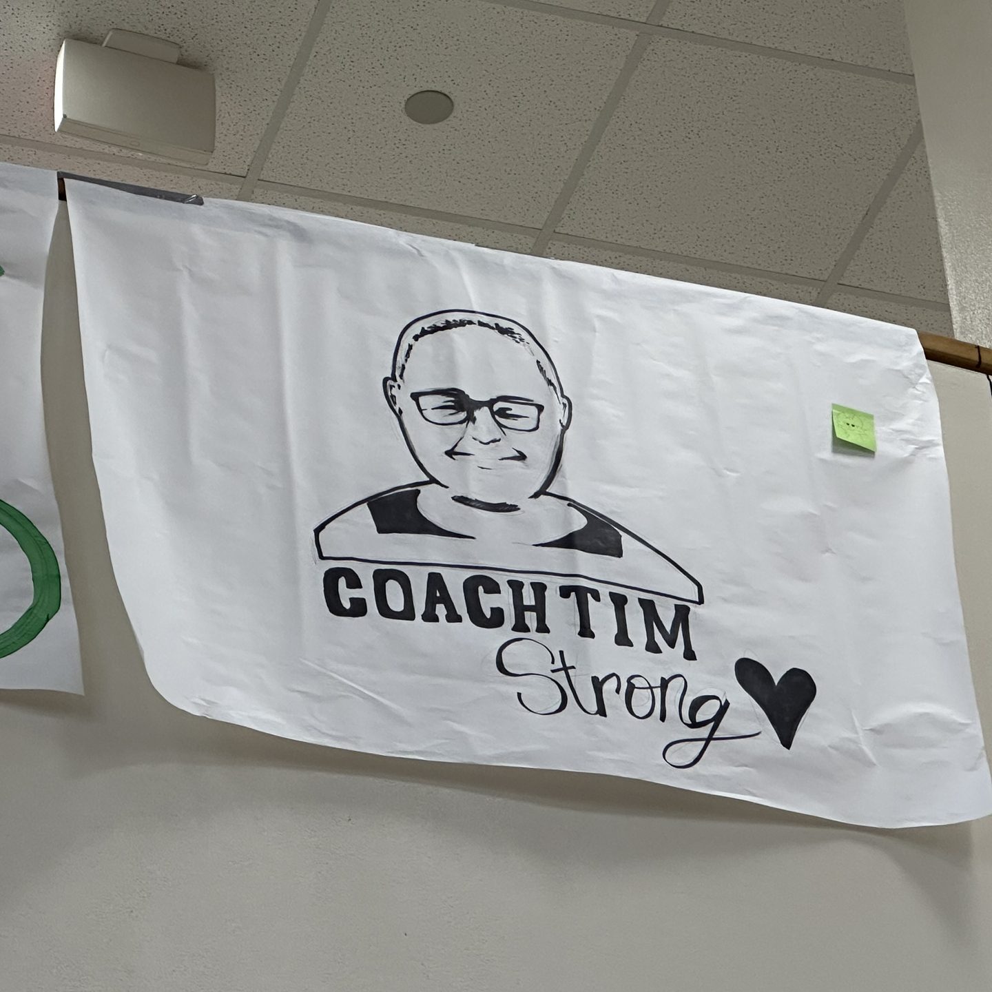 Coach Tim Strong image was printed on T-shirts to support his recovery.