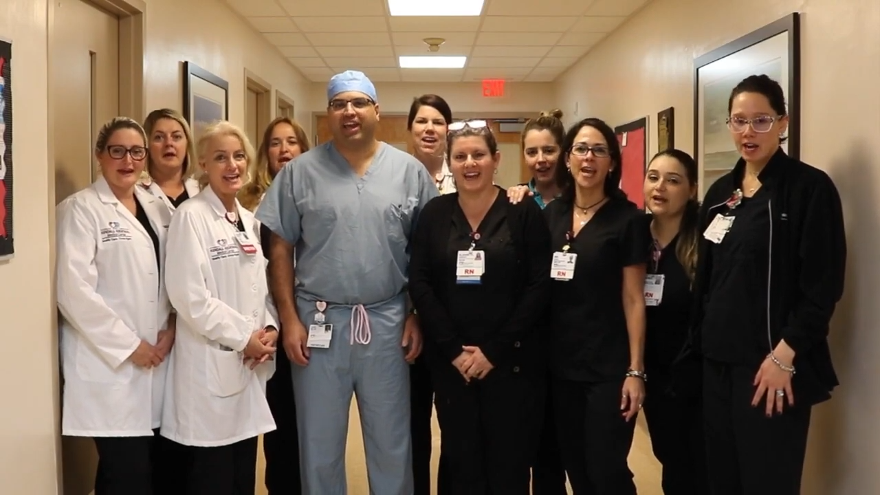 The burn team at Kendall Hospital posing in the hallway
