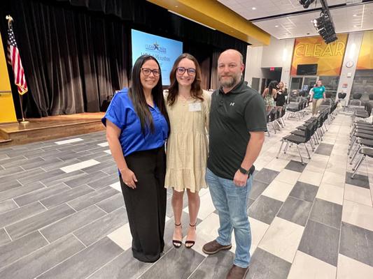 League City residents Alycia and Joshua Hardin standing beside their daughter Ava, a Clear Springs High School senior.
