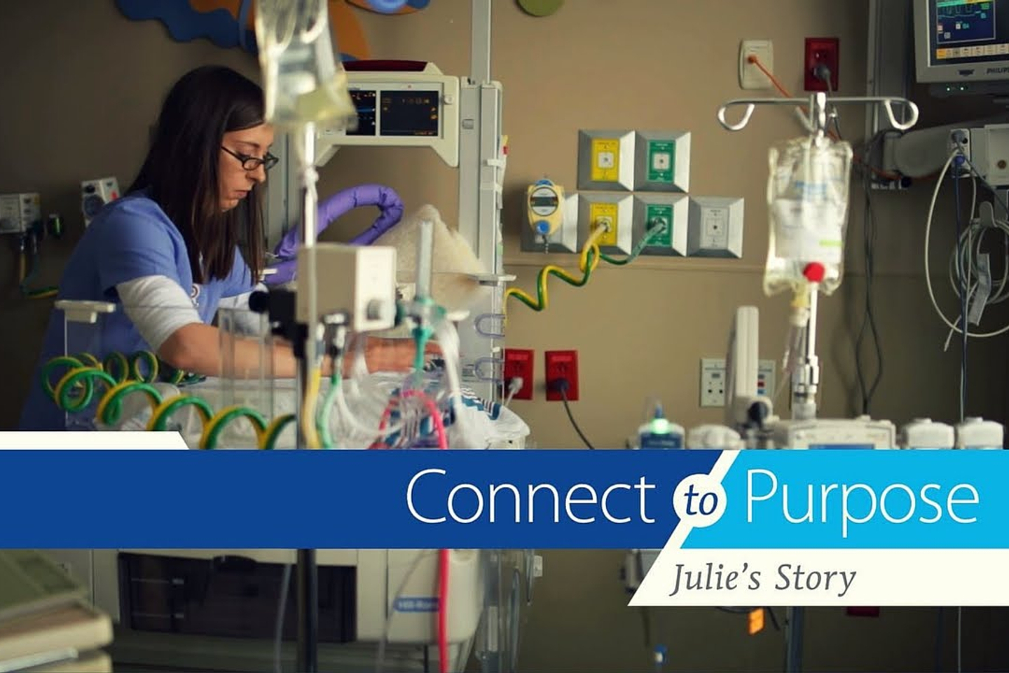 NICU Nurse Julie Freeman leans over an incubator. Connect to Purpose, Julie's Story.