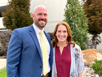 Dr. O. Brant Nikolaus and Charla Bocchiccio stand side by side in an outdoor setting.