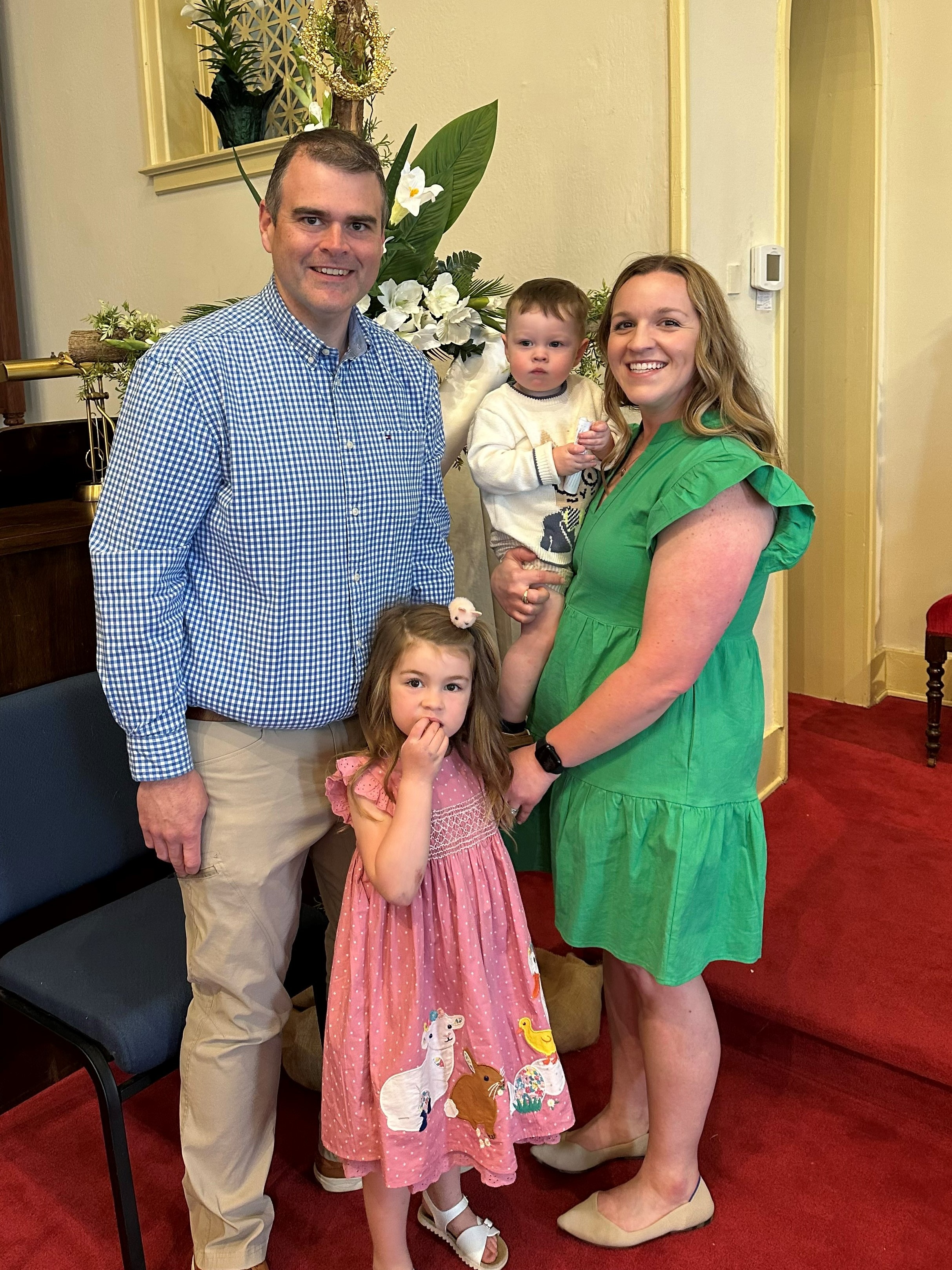 Male patient with wife and 2 daughters standing together after weight loss surgery