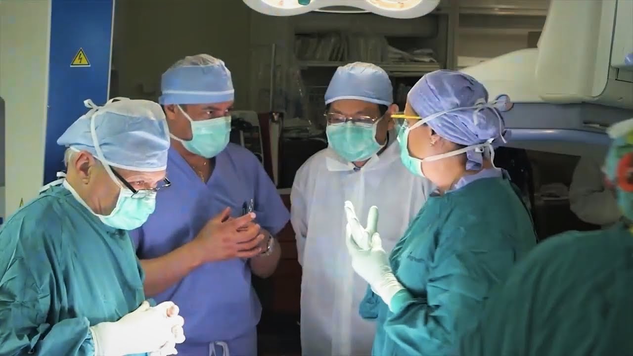 A group of surgeons in the operating room.