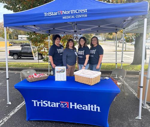 TriStar North Crest Crush the Crisis volunteers at drop-off table