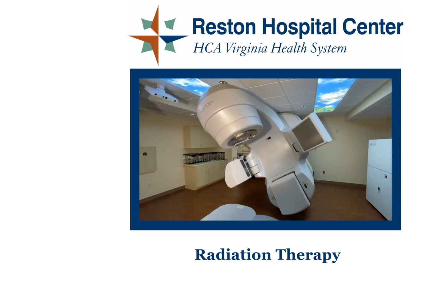 A radiation therapy room with a large rotating machine in the middle. On-screen text reads, "Reston Hospital Center Radiation Therapy."