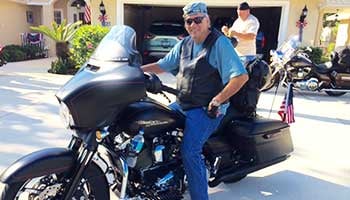 Cancer survivor Mike Dillard on his motorcycle.